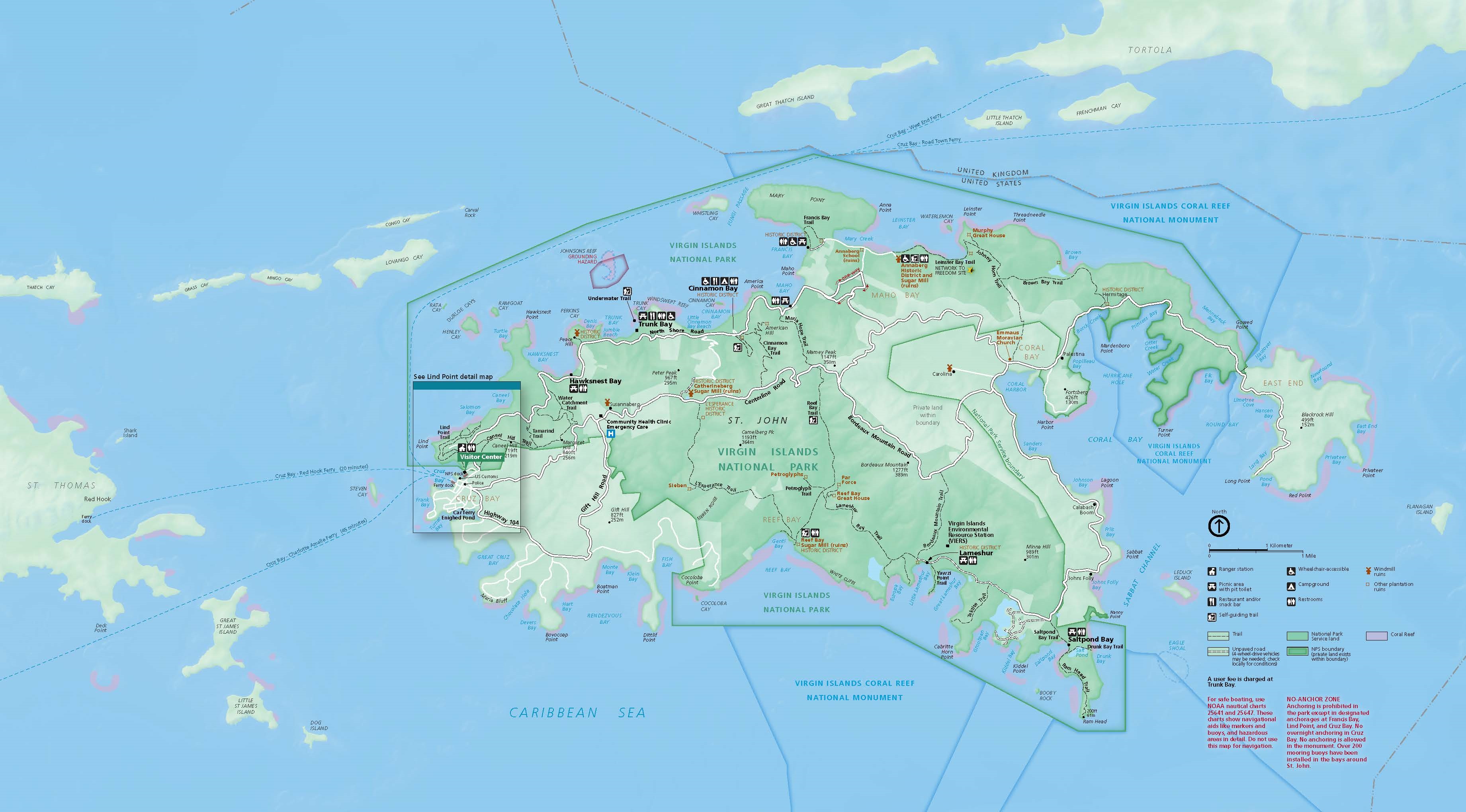 Map of Virgin Islands National Park. The island of St. John is roughly oval but with deeply eroded sides, especially to the east where fingers of land reach around Coral Bay in a C shape. Most of the island is shaded dark green but a few areas are a lighter shade, sites are labeled with black or brown text, and the ocean is in bluet.