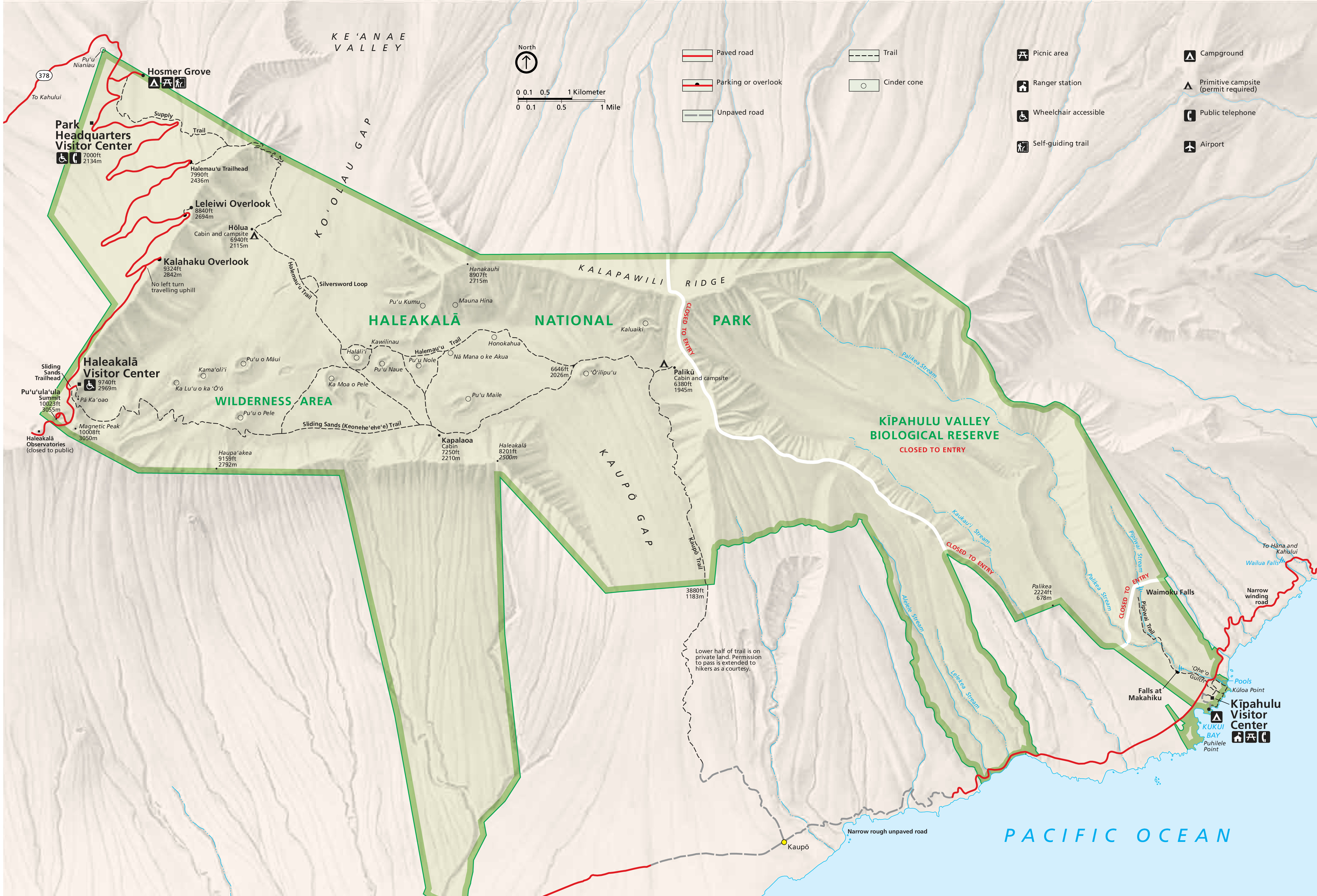 Map of Haleakalā National Park in Hawaii. The park is outlined and highlighted in green with the surrounding area in tan. The park has multiple arms that extend from the main park area towards the Pacific Ocean on the bottom right to just past Koʻolau Gap on the left. Dashed lines represent trails, and red lines are for roads.