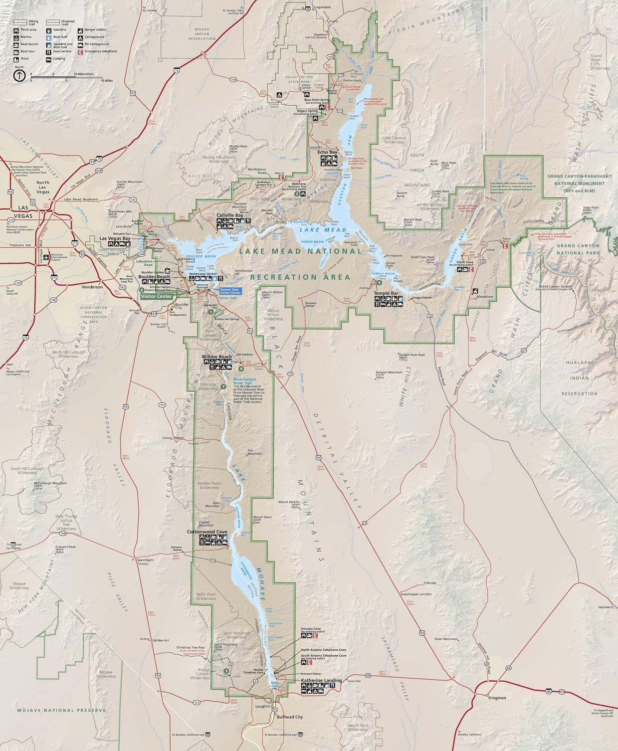 Map of the Lake Mead National Recreation Area in Arizona. The park is roughly shaped like a hammer with a spike at the top. It’s outlined in green, and the surrounding area is tan. Highways are represented by red lines and trails by dotted green lines. Seven sites labeled with white numbers in green circles are scattered through the park.