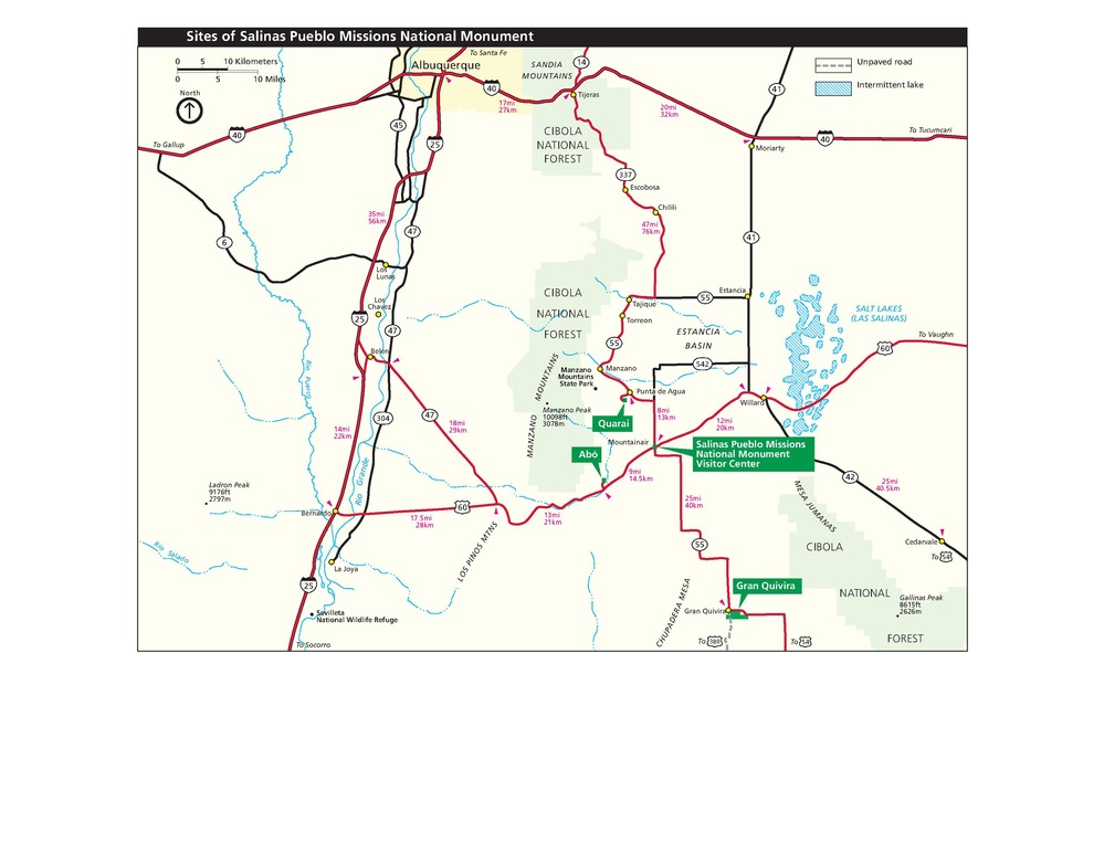 Area map of Salinas Pueblo Missions National Monument in New Mexico. Four sites are labeled with green callout boxes in the bottom right quadrant of the map. National forests are shown in pale green, the town of Albuquerque in yellow, and surrounding areas in beige.