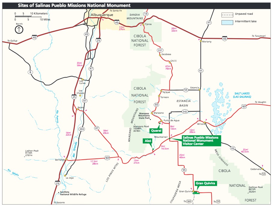 Area map of Salinas Pueblo Missions National Monument in New Mexico. Four sites are labeled with green callout boxes in the bottom right quadrant of the map. National forests are shown in pale green, the town of Albuquerque in yellow, and surrounding areas in beige.
