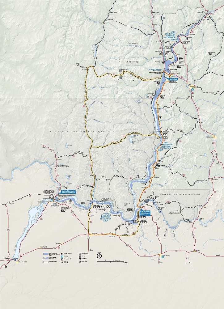 Map of Lake Roosevelt National Recreation Area in Washington. The park is shown in dark blue, and the surrounding terrain is represented in beige. Roads are shown with black or red lines, some of which are highlighted in yellow to represent scenic drives.