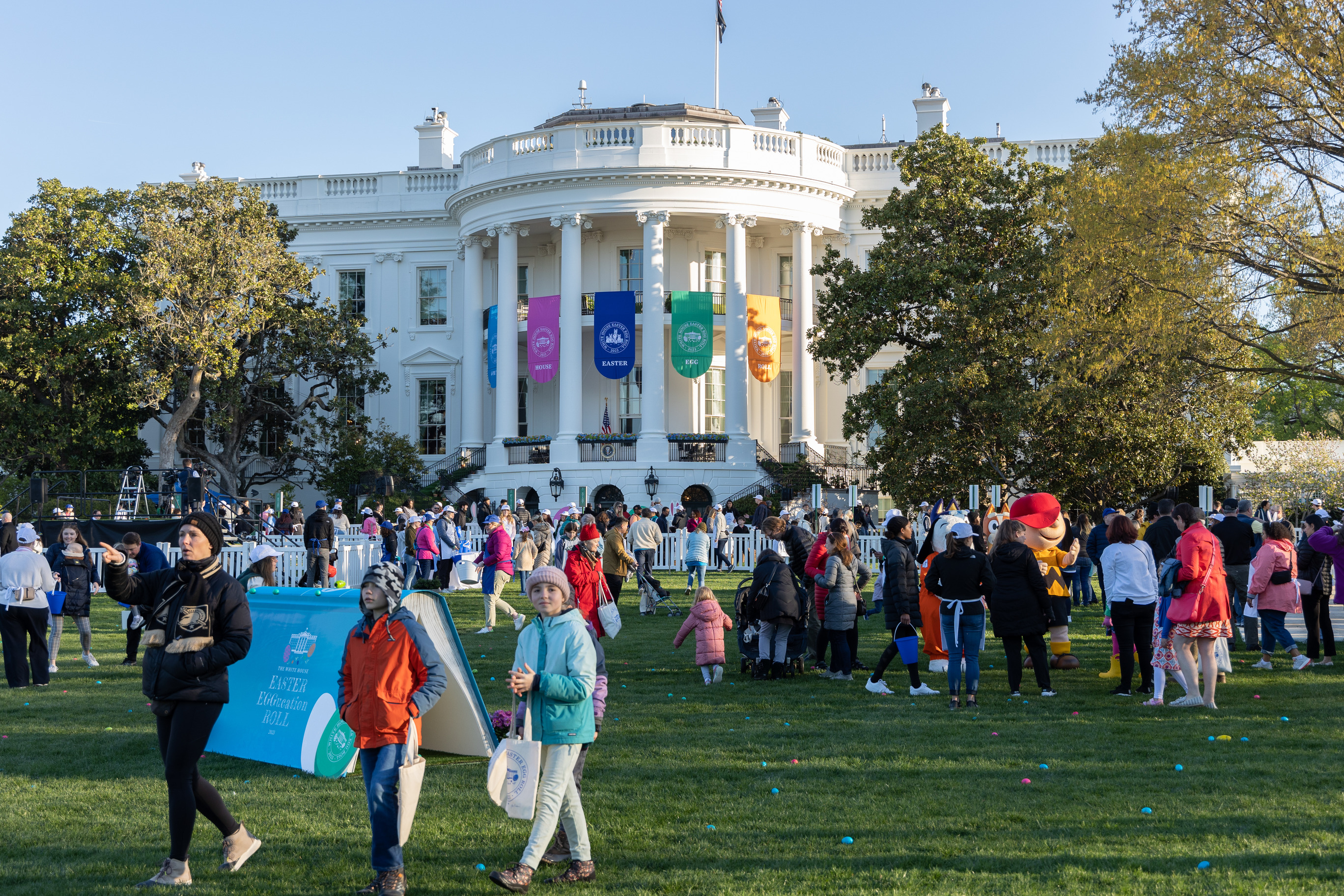 Visitors hunt for colorful Easter Eggs in front of the White House.