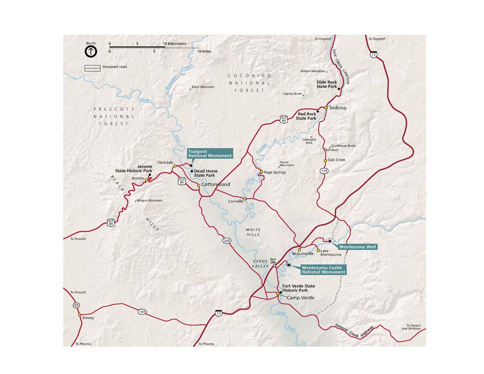 Map of Montezuma Castle National Monument in Arizona. Roads represented in red cross sparsely across the beige terrain to connect eight sites and ten towns.