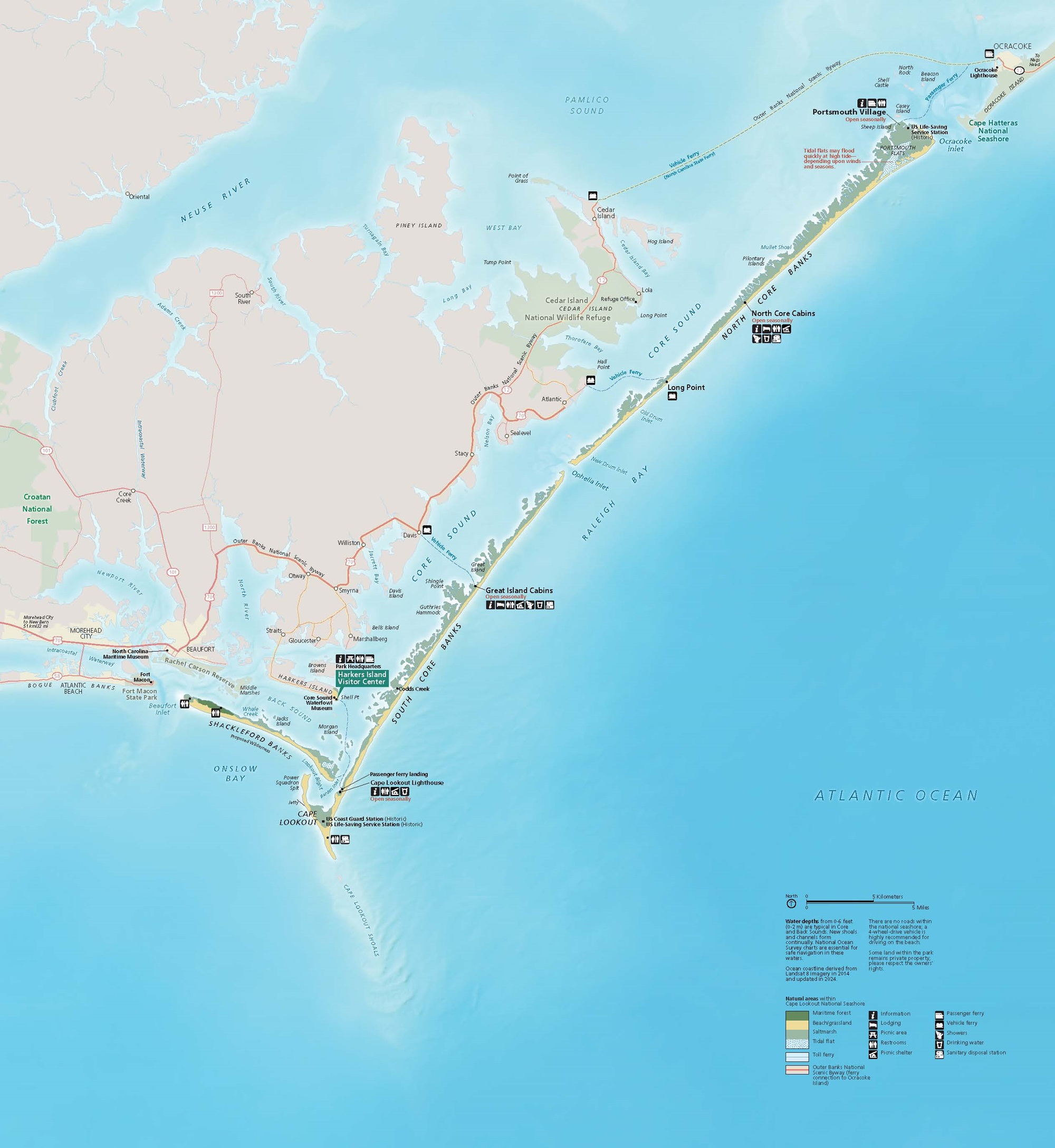 Map of Cape Lookout National Seashore in North Carolina. The park area is shaded green and yellow, its long banks shaped like a checkmark below the mainland, stretching up to Cape Hatteras National Shore. The rivers and bays are pale blue, and the Atlantic Ocean is a deeper blue.