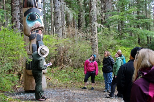 Ranger taking a group of visitors on the Totem Walk.