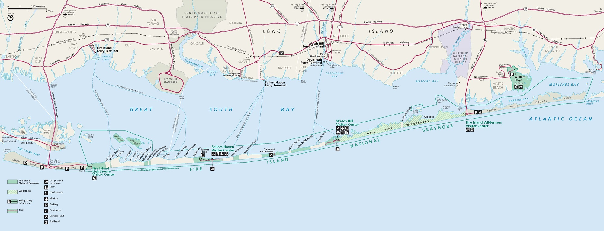 Map of Fire Island National Seashore in New York. Park area is shaded green and delineated with a green outline covering a long, narrow horizontal stretch of land between the Great South Bay and the Atlantic Ocean. State park areas are taupe, and other land is beige.
