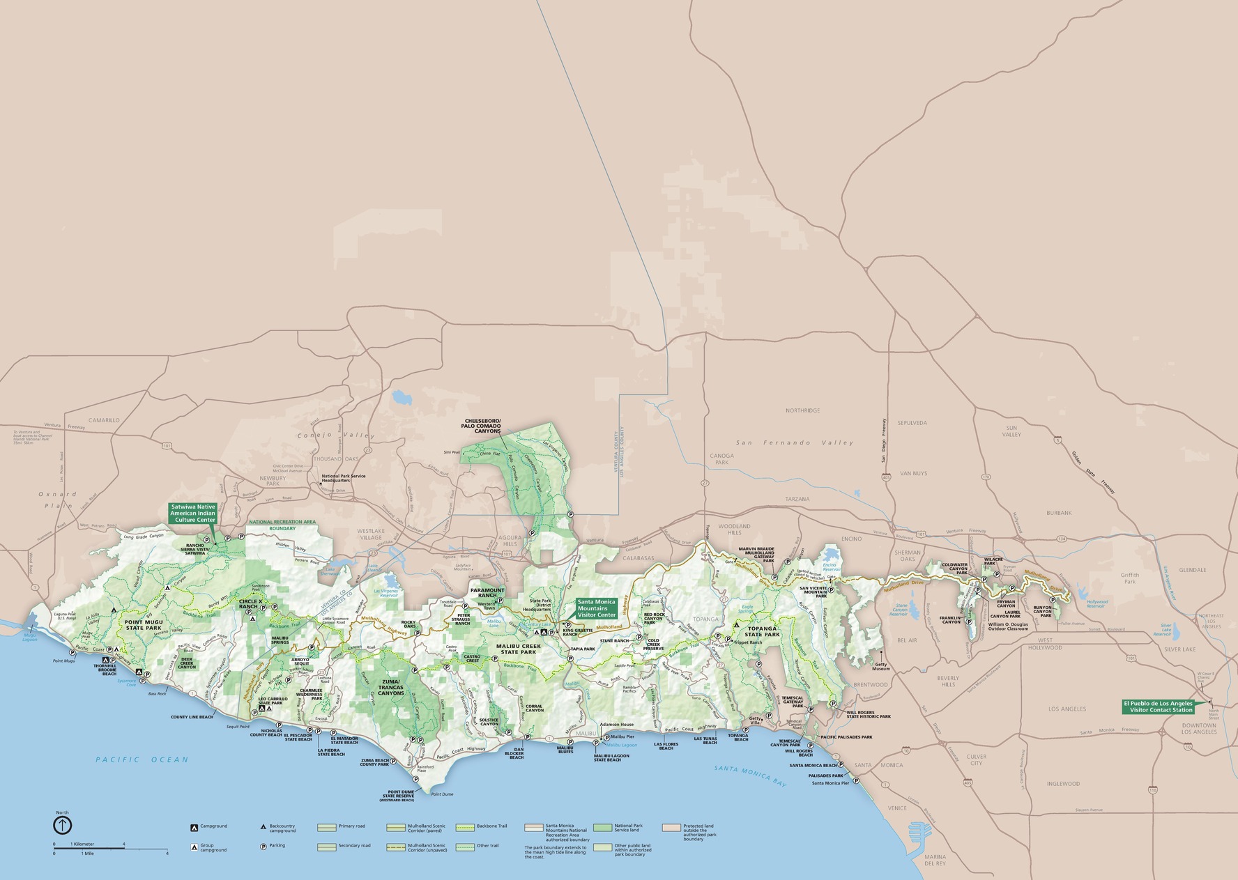 Park map of Santa Monica Mountains National Recreation Area, which stretches along a coastline running east-west in southern California. Park areas are indicated with shades of green. The Pacific Ocean and Santa Monica Bay below are blue, and terrain to the north is brown. 