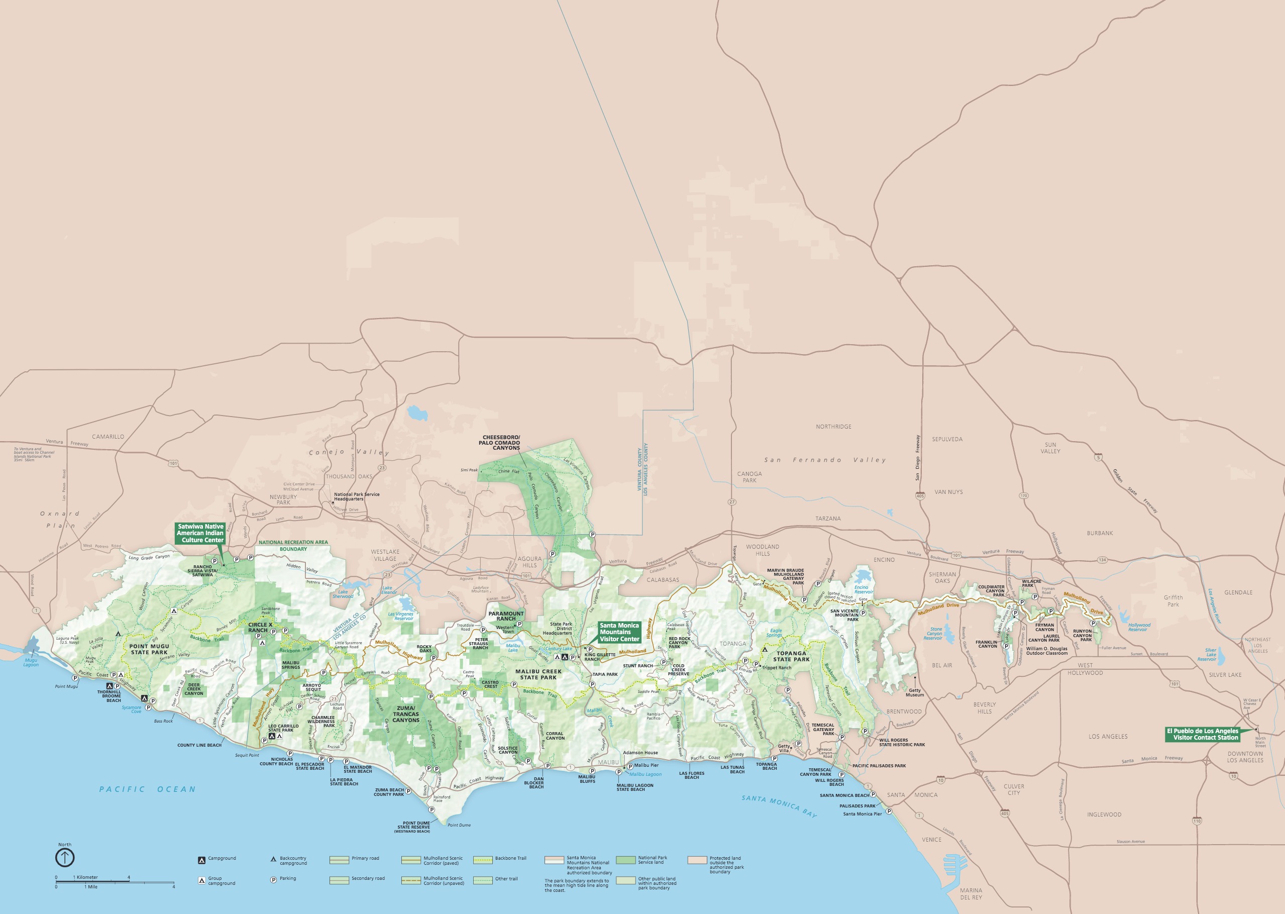 Park map of Santa Monica Mountains National Recreation Area, which stretches along a coastline running east-west in southern California. Park areas are indicated with shades of green. The Pacific Ocean and Santa Monica Bay below are blue, and terrain to the north is brown. 