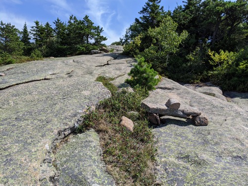 Rock cairn along an exposed section of trail