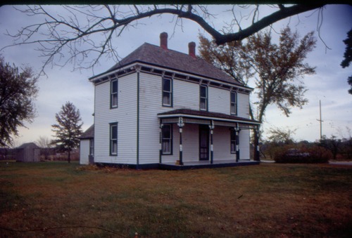 Image of a two-story white farm house.
