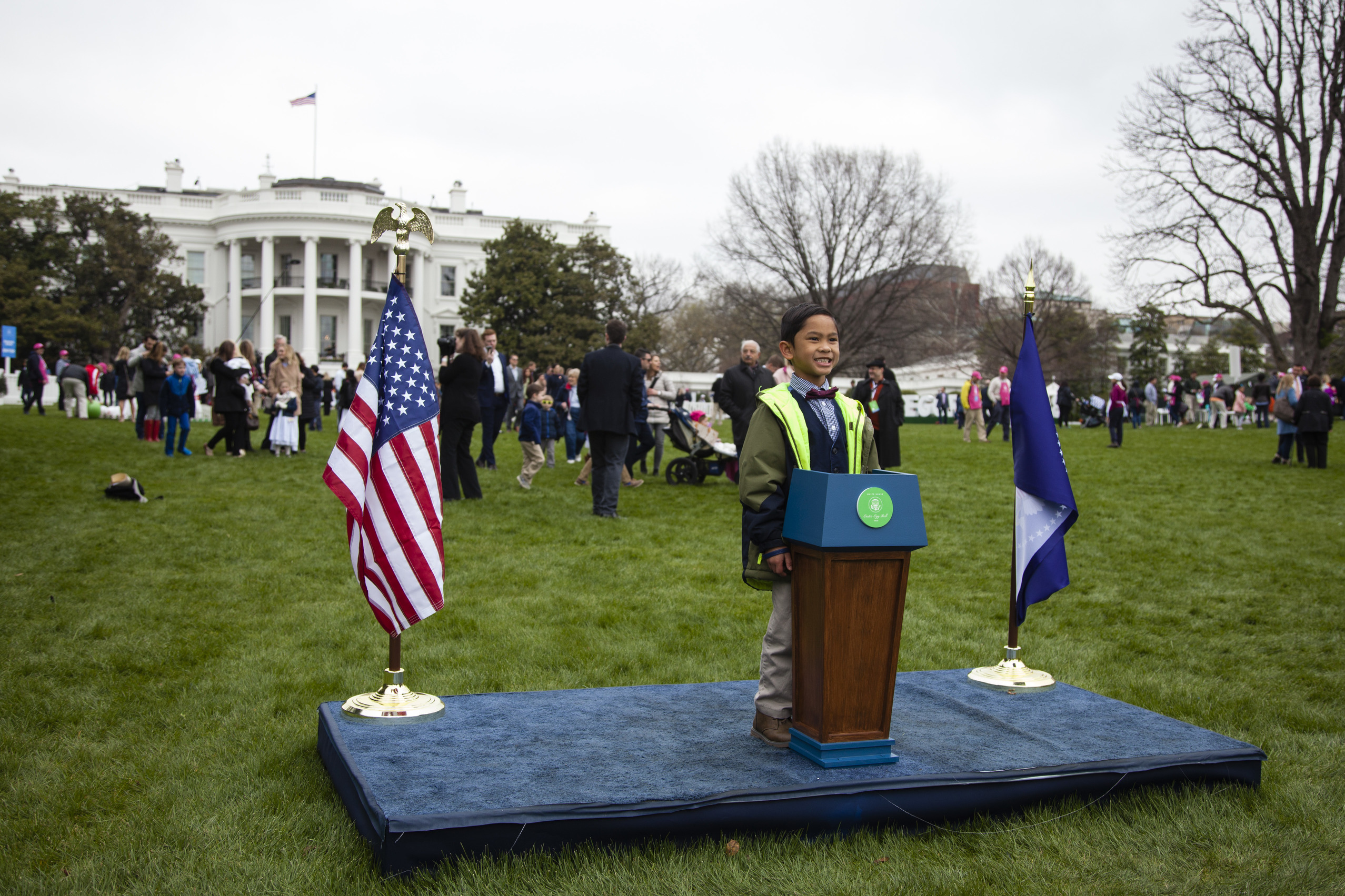 A young boy poses as the future President of the United States in front of the White House. 