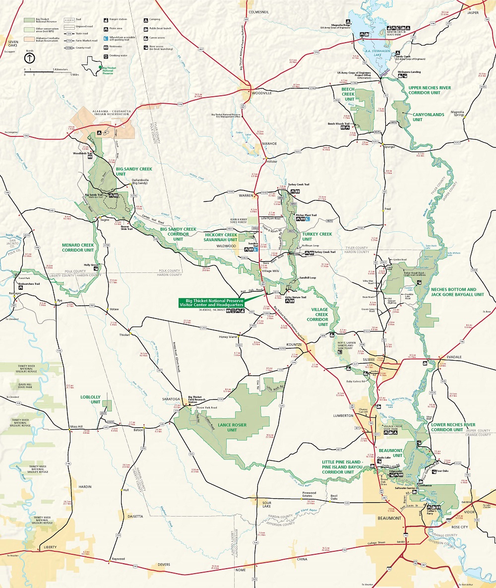 Map of Big Thicket National Preserve in Texas. Fifteen units shaded in green are spaced across an expanse of beige-colored terrain. They and towns shown in yellow, national wildlife refuges shown in pale green, and bodies of water shown in blue are connected by a network of county, farm-market, and state roads.