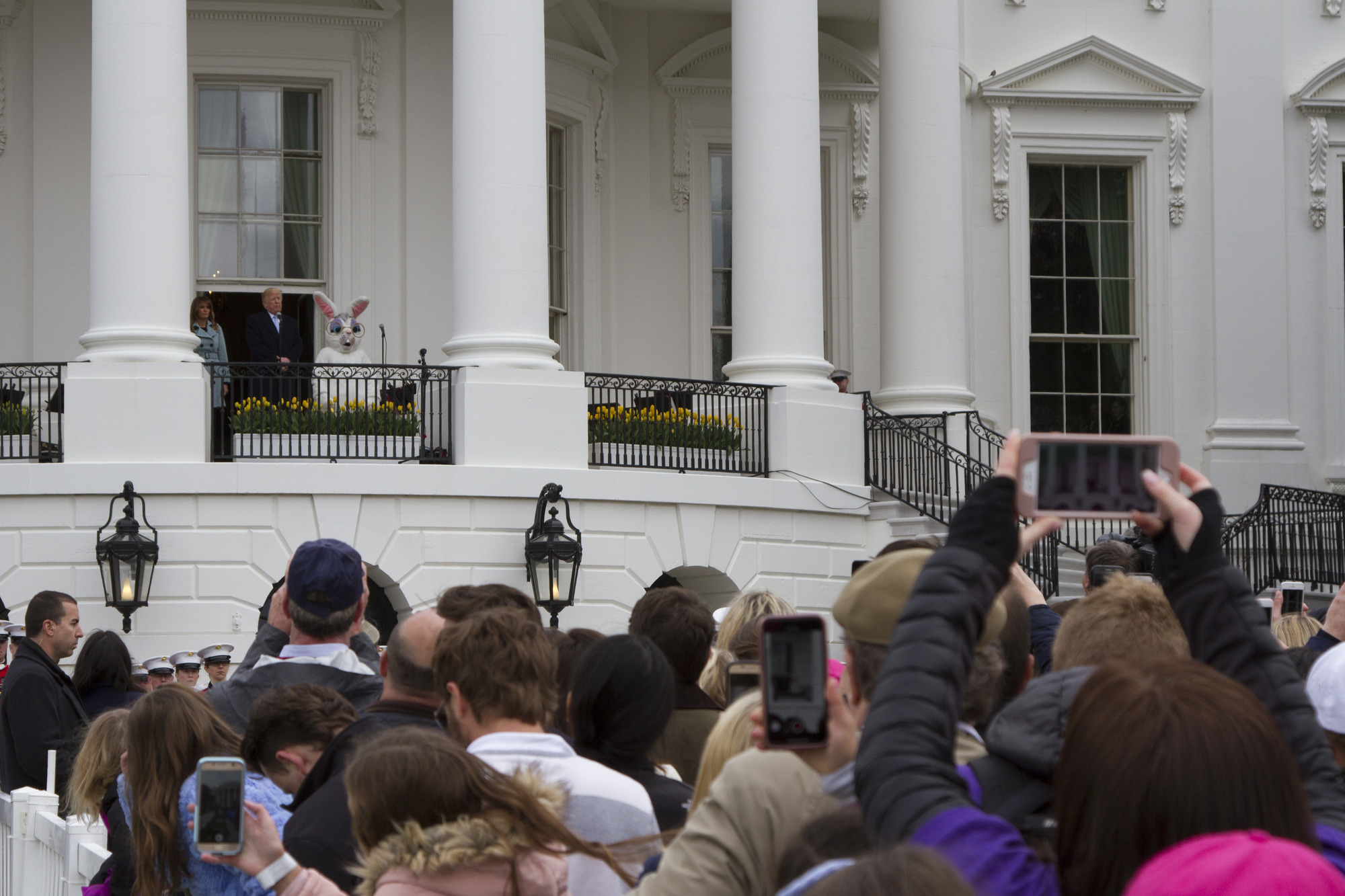 President Donald Trump and First Lady Melania Trump address visitors at the 2018 Easter Egg Roll . 