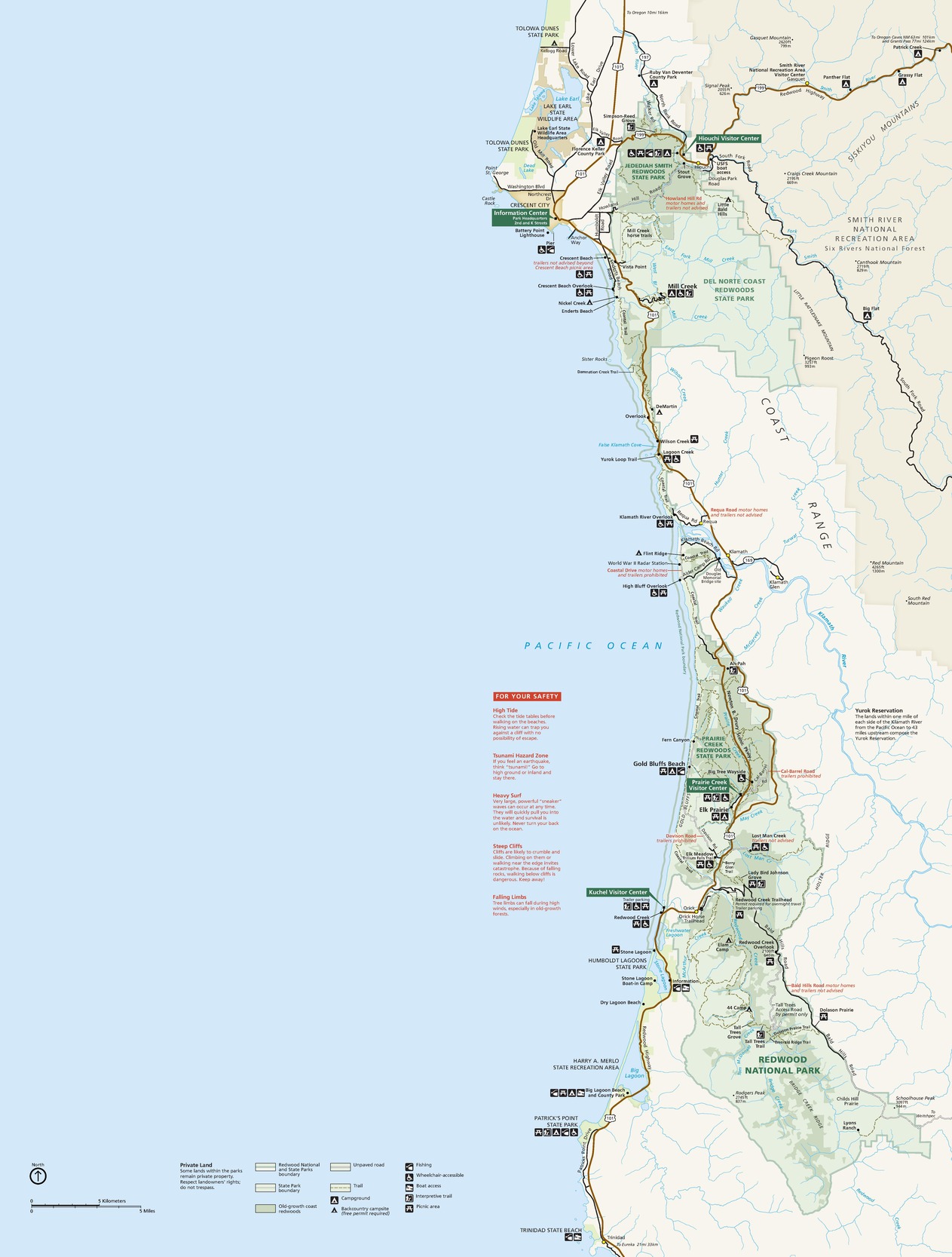 Map of Redwood National and State Parks in California. Park grounds are noted in varied shades of green, which stretch long and thin along the coast of the blue Pacific Ocean, and surrounding lands are indicated in white and pale yellow.