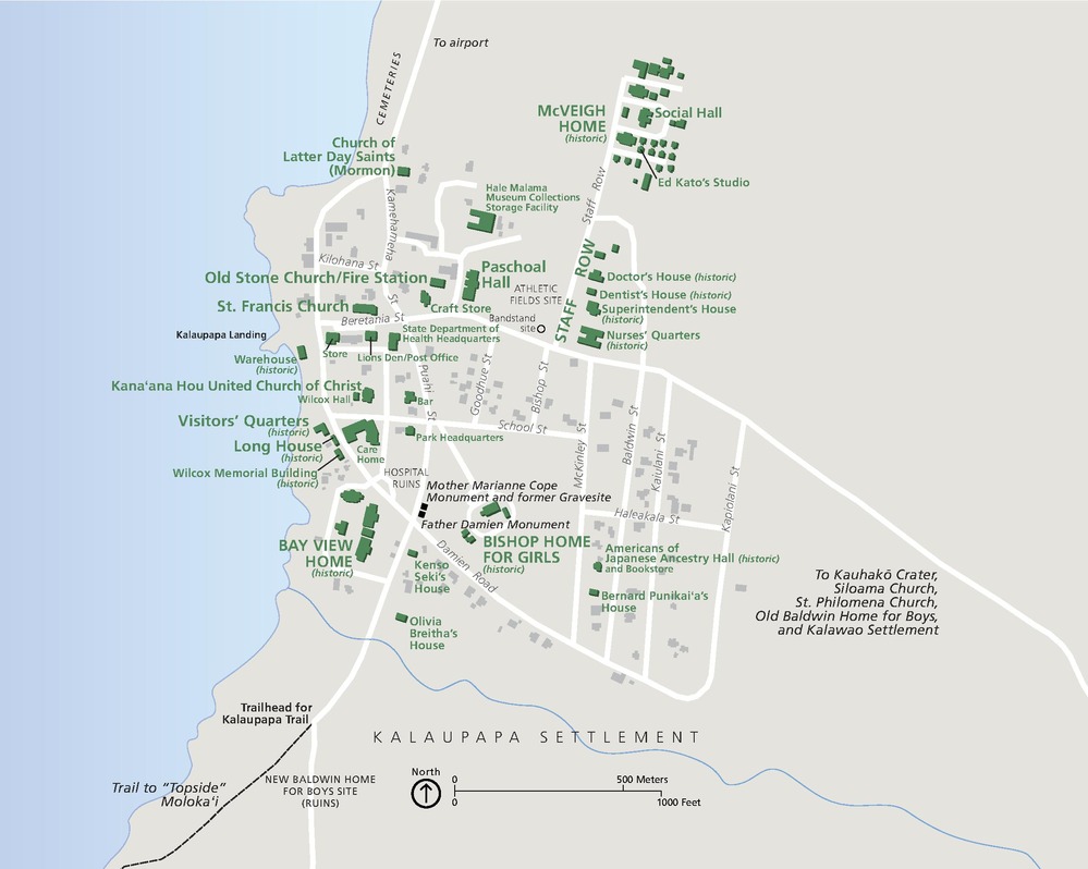 Map of Kalaupapa National Historical Park along a western, oceanside coast in Hawaii. A grid of streets is shown in white against a tan background, and a couple dozen sites are identified and labeled in green or in gray and black.
