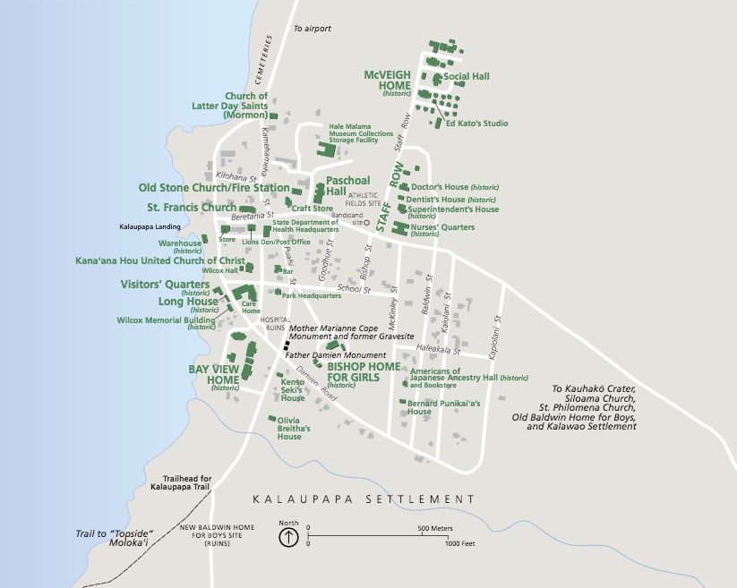 Map of Kalaupapa National Historical Park along a western, oceanside coast in Hawaii. A grid of streets is shown in white against a tan background, and a couple dozen sites are identified and labeled in green or in gray and black.