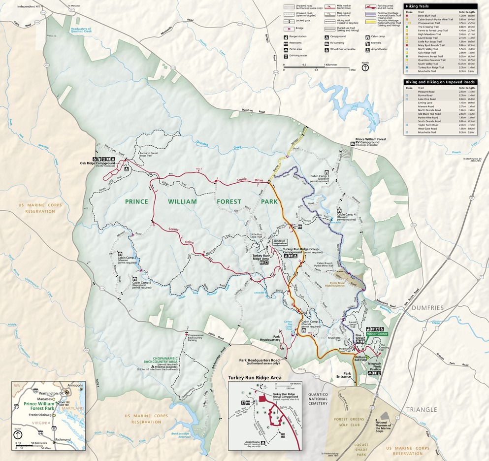 Map of Prince William Forest Park in Virginia. The sage-green, gourd-shaped park is oriented with a narrow end pointing northwest. It is surrounded by beige terrain to the east and the pale orange terrain of the US Marine Corps Reservation to the west.