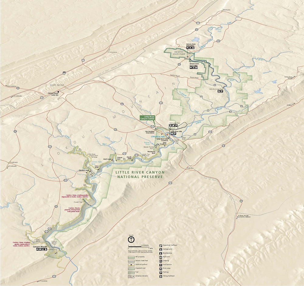 Bird’s eye view map of the long and narrow Little River Canyon National Preserve in Alabama. The edges of this canyon are jagged like pixelation. The park runs southwest to northeast along the meandering Little River. The park is outlined and filled in with green. Rivers are marked with blue, roads with red, and a scenic drive with yellow. 