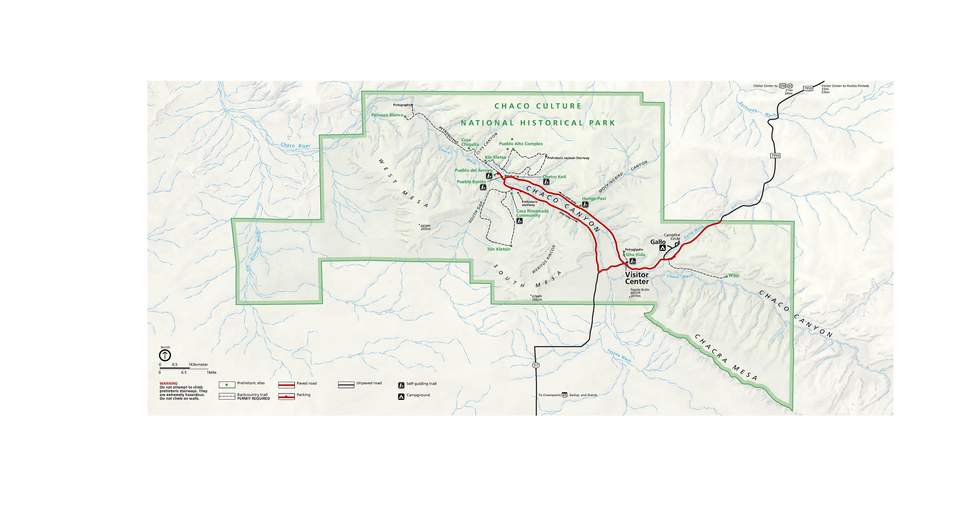 Map of Chaco Culture National Historical Park in New Mexico. The park is outlined in green and filled in with a lighter shade. The surrounding areas are beige. Roads represented with red or black lines.