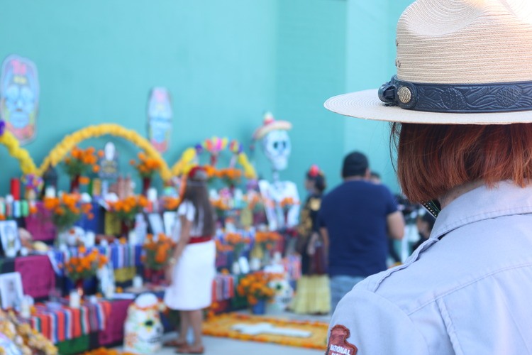 Park Ranger hat with the ofrenda in the background. 
