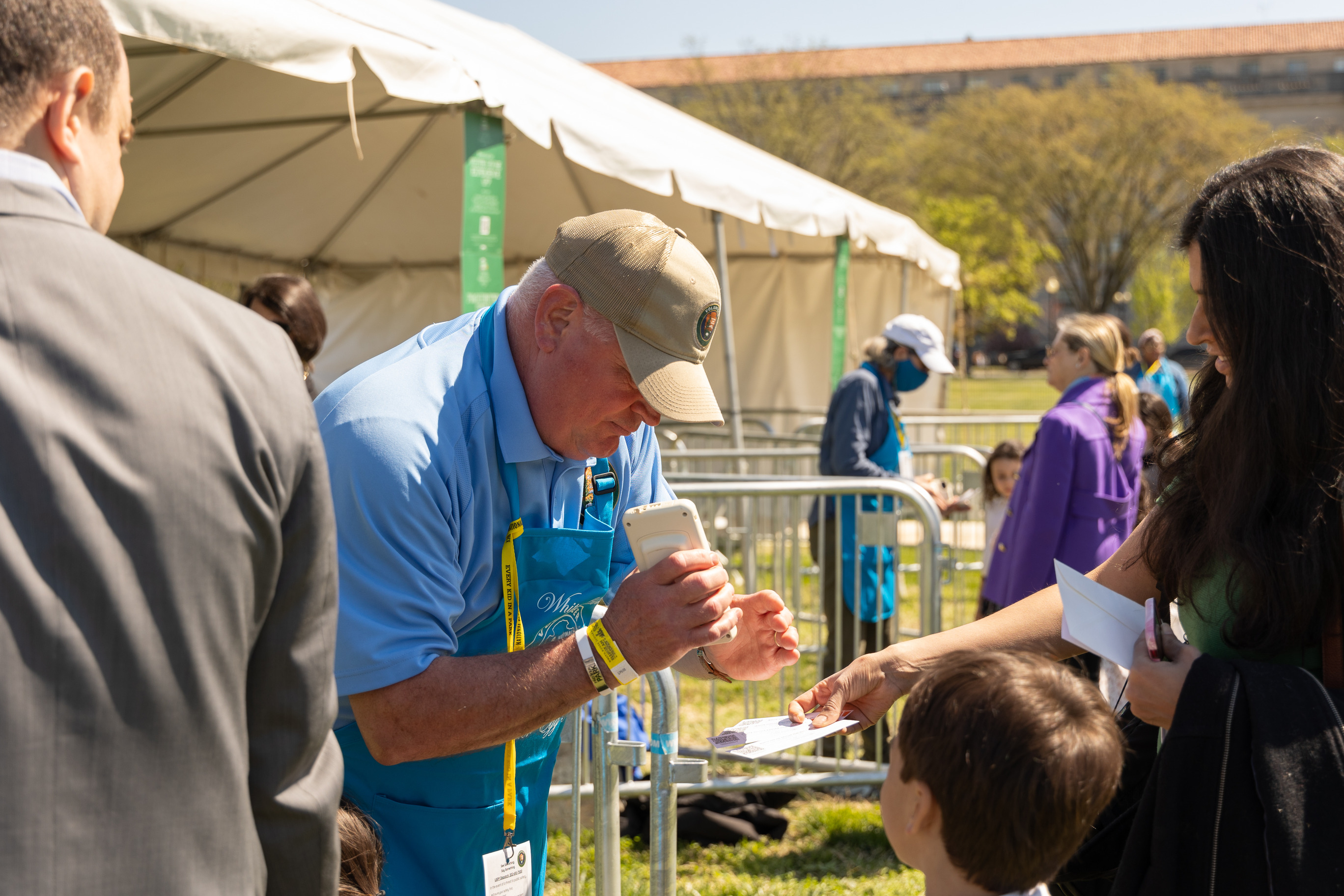 A volunteer scans visitors tickets