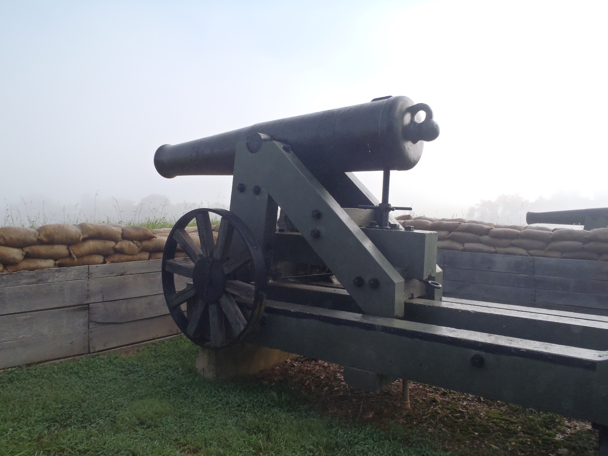 cannon, carriage, sandbags, fog