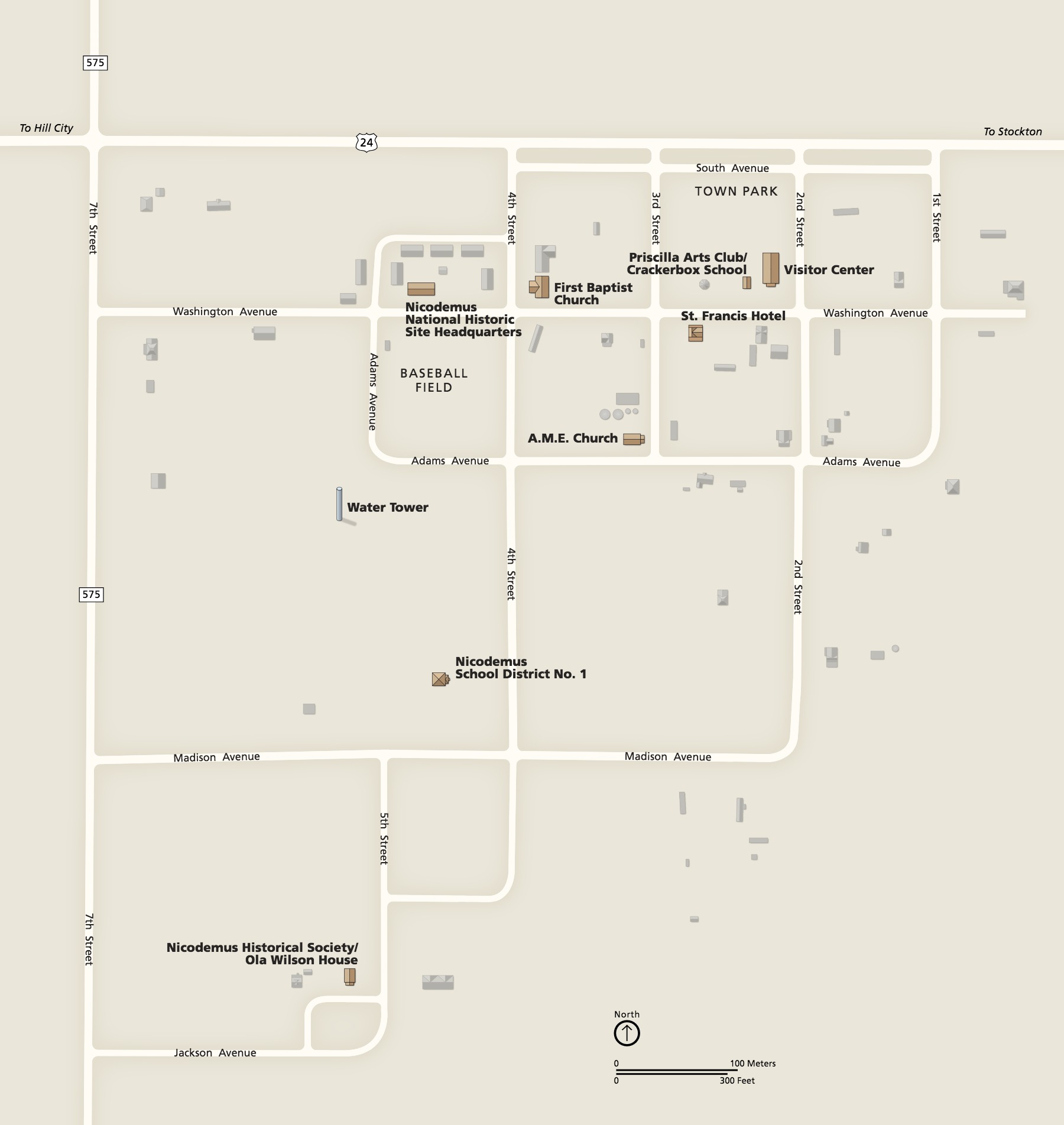 Map of Nicodemus National Historic Site in Kansas. A stepped grid of streets is shown in white against a tan background, and named buildings are shown in perspective in brown. Other buildings around the site are grayed out.