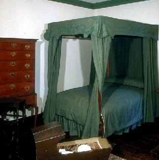 The southwest bedchamber has a bed with green wool bedhangings, reproductions of ones Elizabeth Derby brought to her marriage.