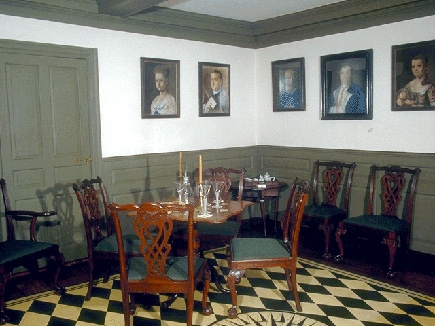 The southwest parlor of the Derby House is arranged for a card party.