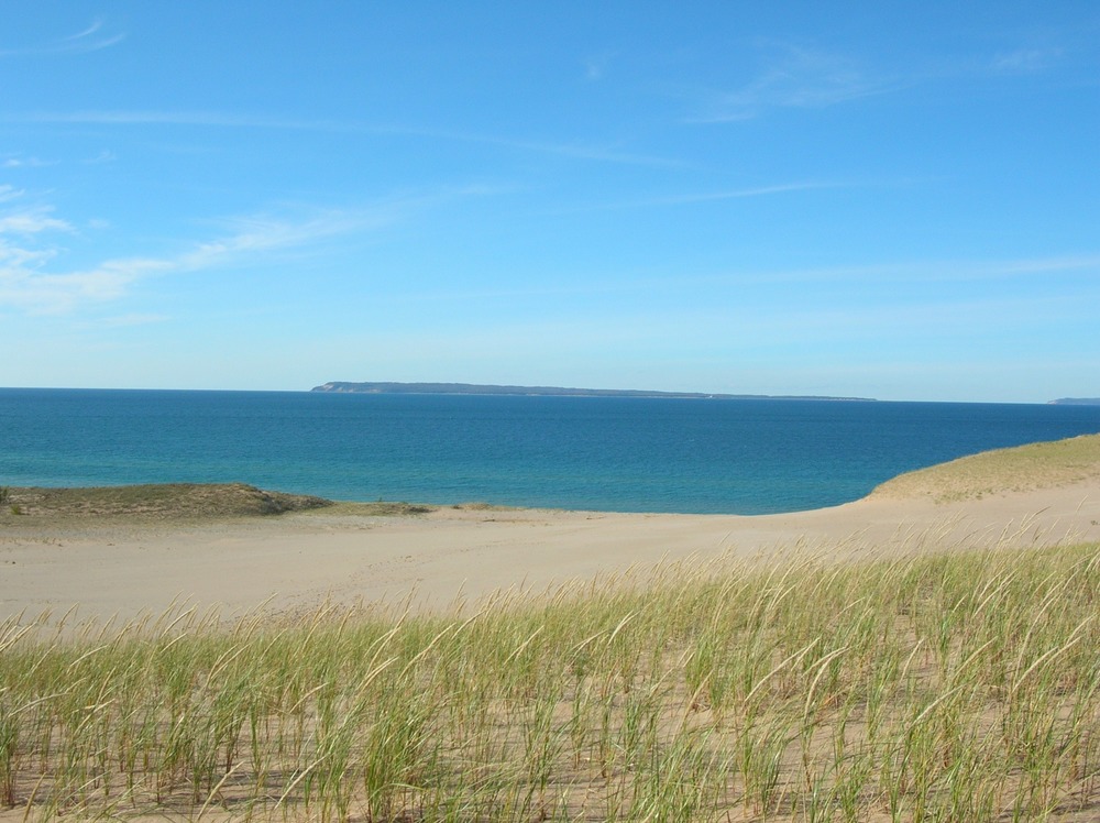 View of South Manitou Island rising from Lake Michigan over the forested dune ridges at Sleeping Bear Point