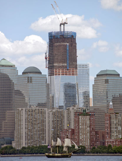 The Friendship of Salem sails past the World Trade Center Site as the Freedom Tower rises in the background.