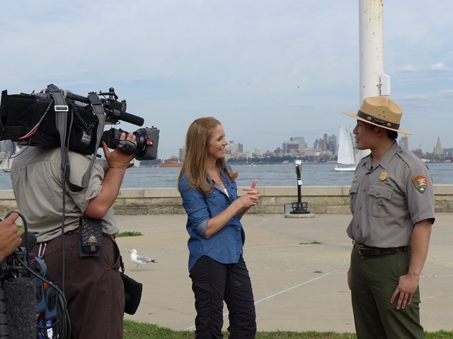 At Ellis Island, Park Ranger Peter Wong gives an interview. At Ellis Island, Park Ranger Peter Wong gives an interview.