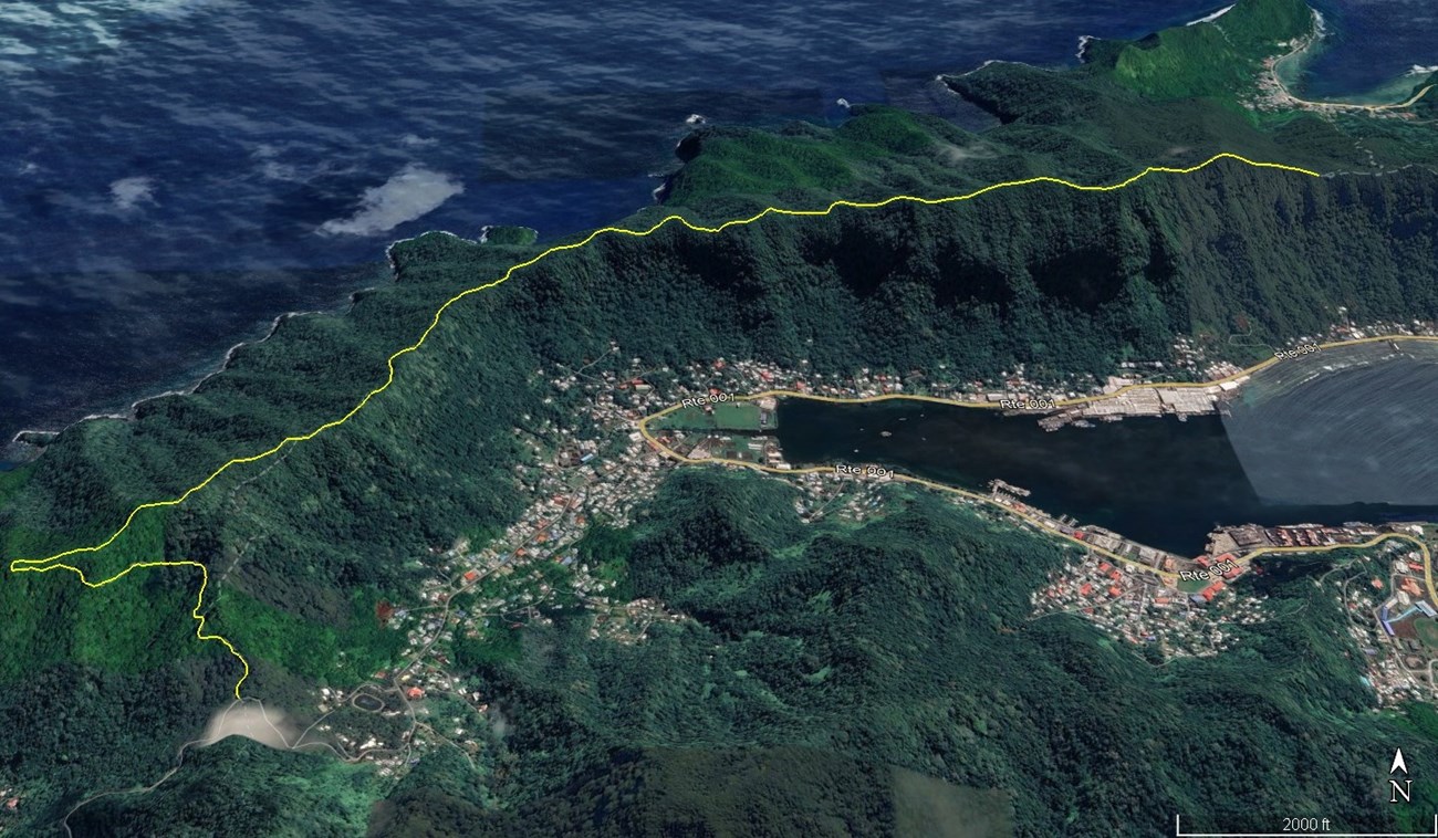 A satellite view of Mt. Alava and surrounding areas with a yellow line indicating the Mt. Alava Trail. The trail weaves through lush green mountainous terrain, overlooking Pago Pago Harbor and the coastline.