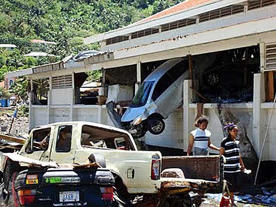 The park Chief Scientist's car is seen here, wedged into the second story of a building The park Chief Scientist's car is seen here, wedged into the second story of a building