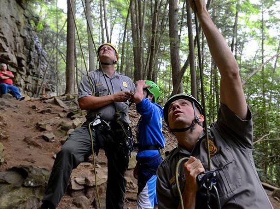 Park rangers instruct novice climbers on the fundamentals of rock climbing during a Climb With a Ranger program.