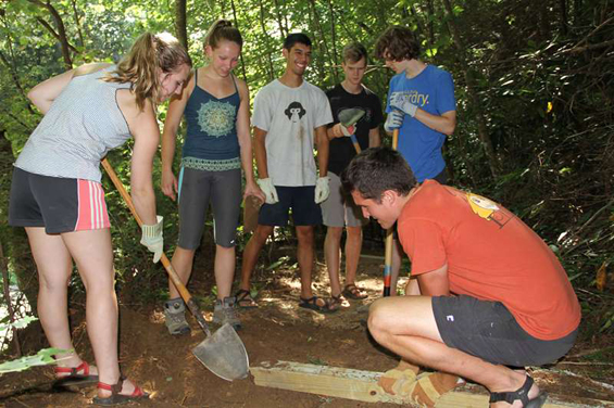 group of kids working on crag