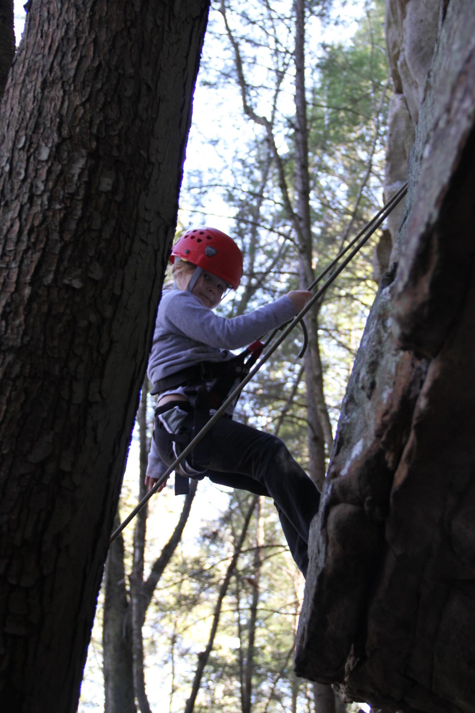 Kid climbing rock