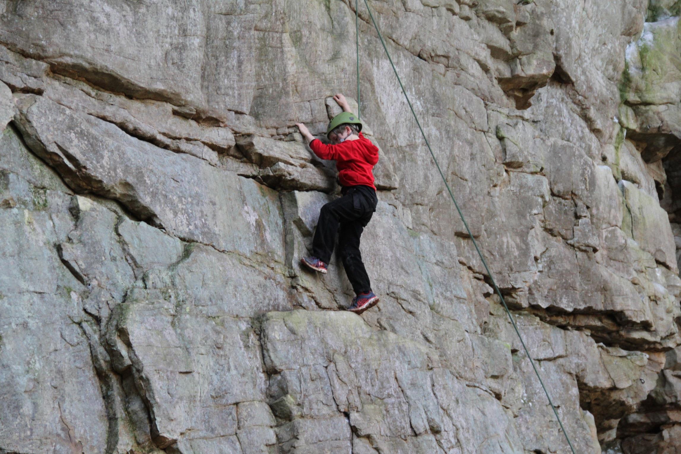 Kid learning to climb