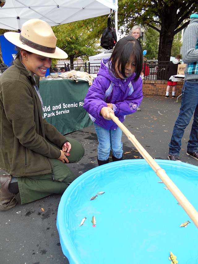 Park ranger interacting with youth