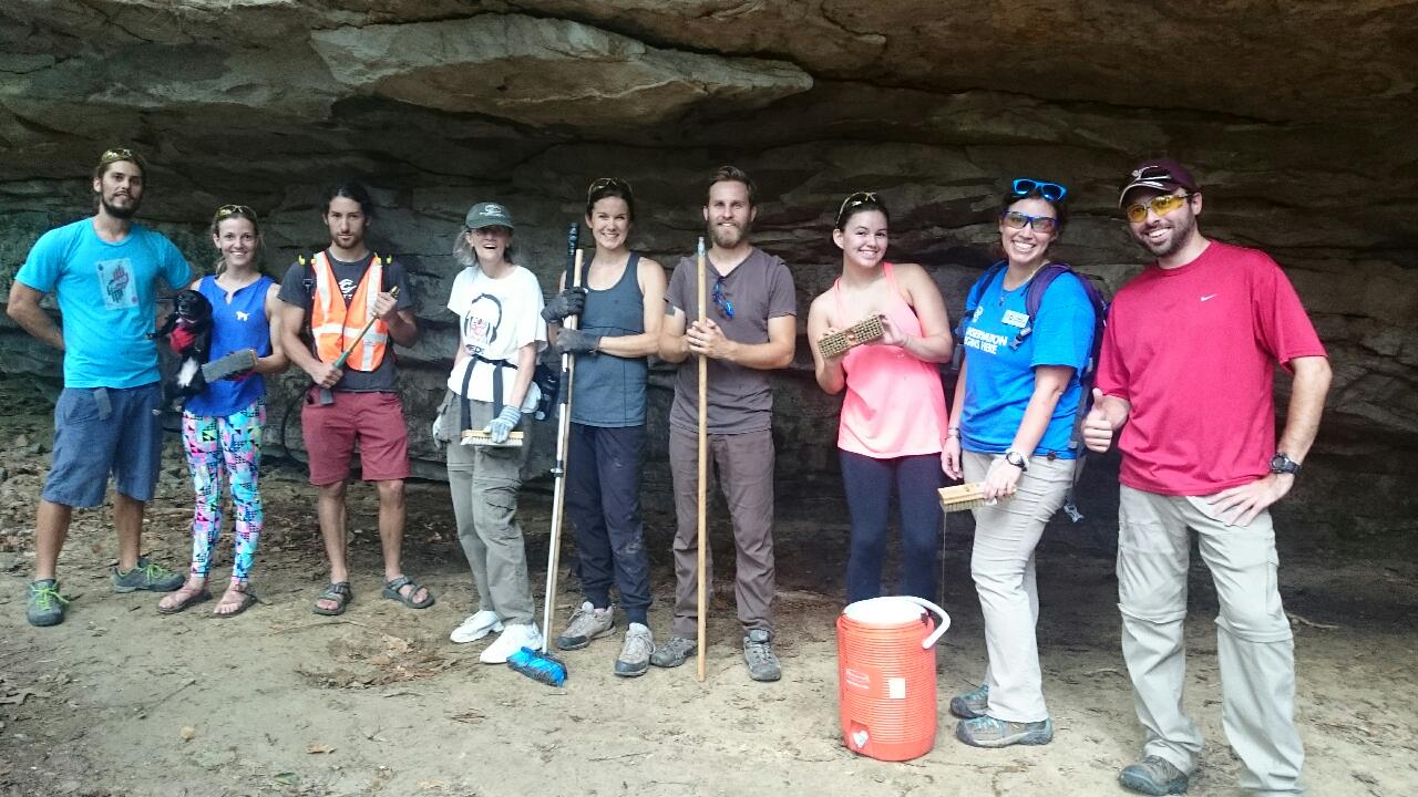 Volunteers removing graffiti