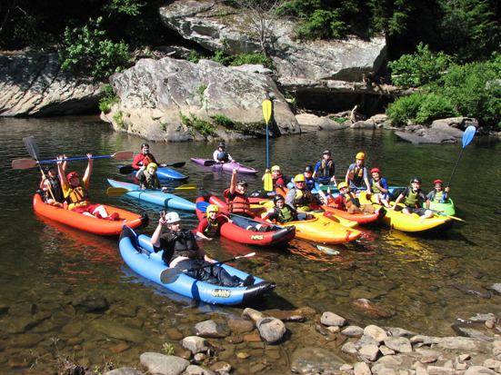 Group of kids in funyaks on river