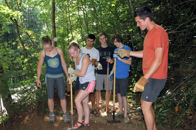 volunteers doing trail work