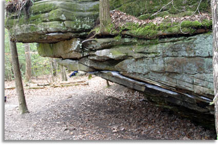 Rock ledge hanging over trail