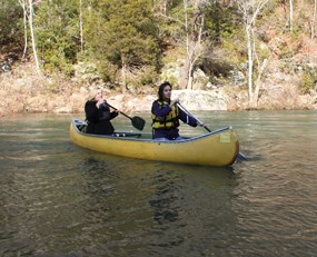 Two women canoeing on Clear Creek.