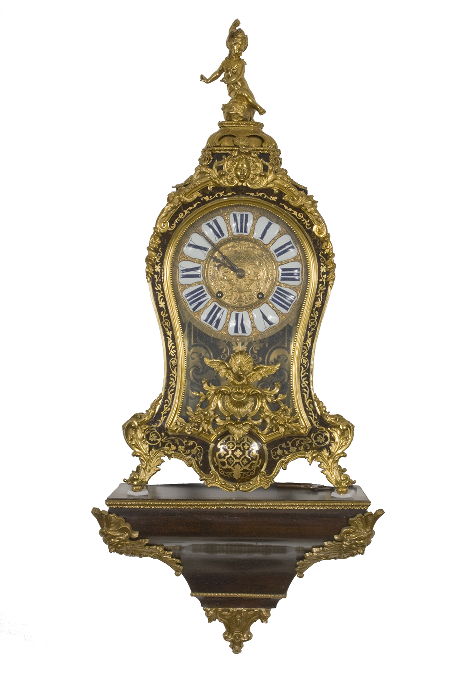 An 18th century clock in the Louis XIV style, with brass and tortoiseshell inlay. An 18th century clock in the Louis XIV style, with brass and tortoiseshell inlay.