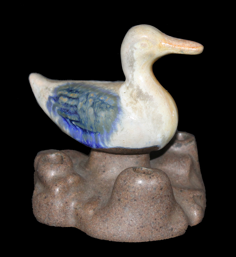 An early 20th century Fulper Pottery flower frog in the shape of a duck. A Fulper Pottery flower frog in the shape of a duck.