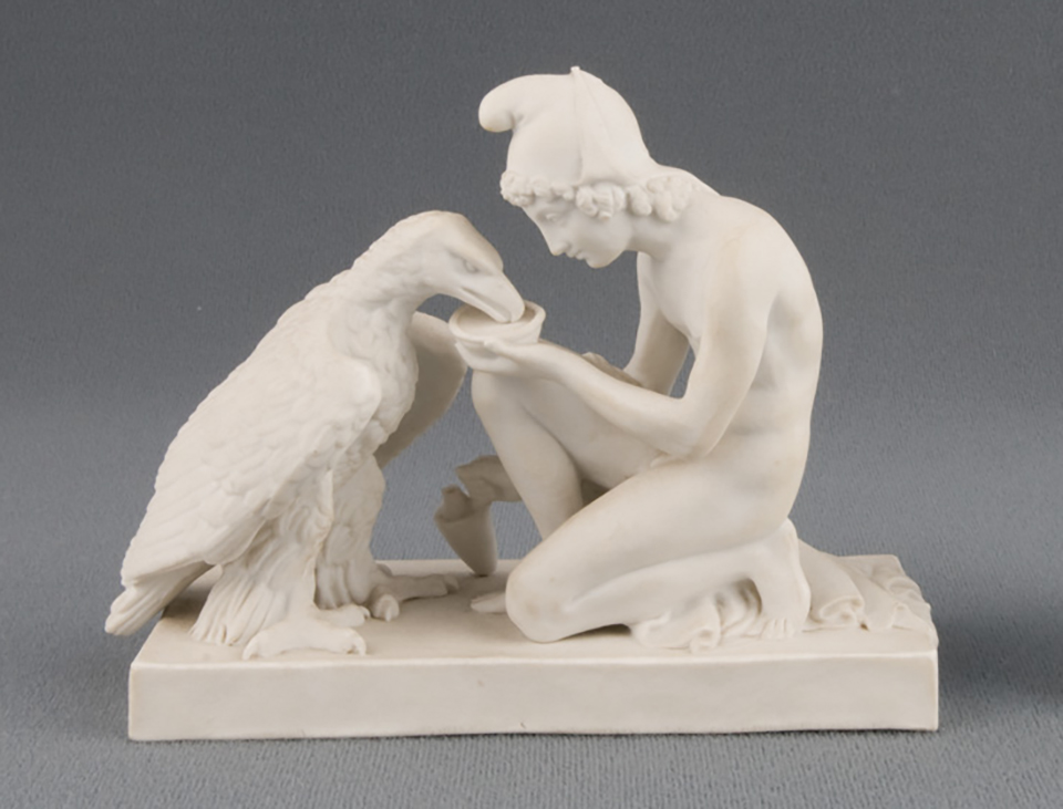 A parian figurine of Ganymede, feeding honey to Zeus in the form of an eagle. A parian figurine of Ganymede and Zeus as an eagle.