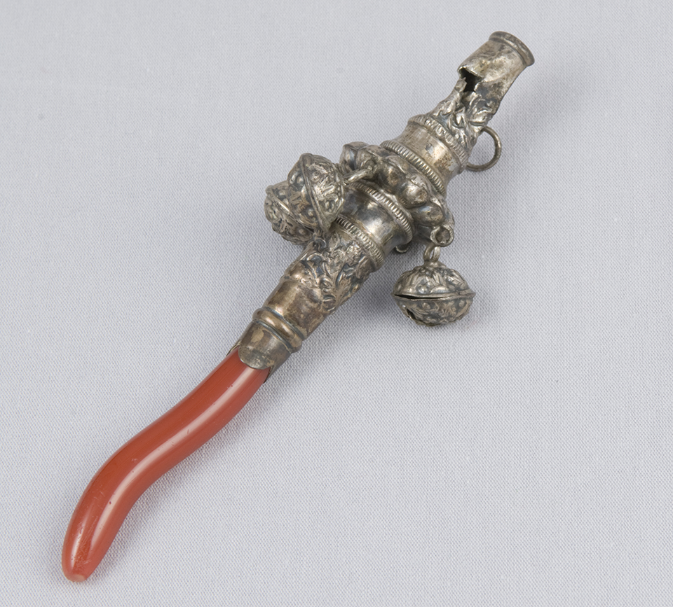 A silver and coral baby rattle.