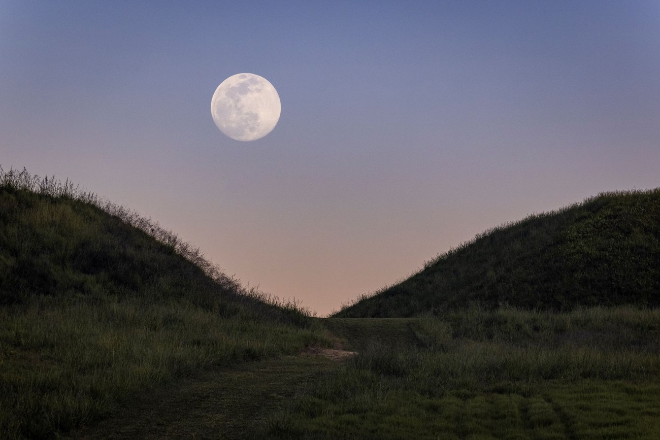 A view of two mounds at nighttime